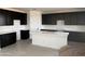 Modern kitchen featuring white countertops and dark cabinets, with wood flooring at 22392 W Monona Ln, Surprise, AZ 85387