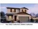 Charming two-story home with a two-car garage, tasteful shutters, and a well-maintained front yard at 22400 W Monona Ln, Surprise, AZ 85387