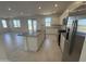 Contemporary kitchen with stainless steel appliances and granite countertops with an island at 22400 W Monona Ln, Surprise, AZ 85387
