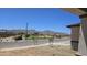 View of the community park with a play area and mountain views at 22400 W Monona Ln, Surprise, AZ 85387