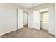 A bedroom features carpeted floors and a sliding closet door at 23259 S 194Th Dr, Buckeye, AZ 85326