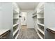 The walk-in closet features shelves and plenty of storage space at 23259 S 194Th Dr, Buckeye, AZ 85326