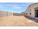 Exterior shot of a spacious backyard with block wall fence at 24610 W Bowker St, Buckeye, AZ 85326
