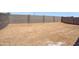 Large, enclosed backyard with dirt, perfect for creating a custom outdoor space at 24610 W Bowker St, Buckeye, AZ 85326