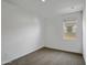 Bedroom with a window for natural light and carpet flooring at 24610 W Bowker St, Buckeye, AZ 85326