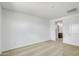 Spacious bedroom with neutral carpet and a doorway leading to the bathroom at 24610 W Bowker St, Buckeye, AZ 85326