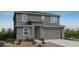 Charming two-story home showcasing a neutral color palette, well-manicured desert landscaping, and an attached two-car garage at 25148 N 167Th Ave, Surprise, AZ 85387