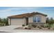 Charming single-story home featuring a two-car garage, landscaped front yard and neutral color palette at 25164 N 167Th Ave, Surprise, AZ 85387