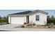 Charming single-story home featuring a two-car garage, neutral stucco facade, and low maintenance desert landscaping at 25169 N 167Th Ave, Surprise, AZ 85387