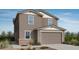 Charming two-story home with a two-car garage, featuring classic architecture and a well-maintained front yard at 25185 N 167Th Ave, Surprise, AZ 85387