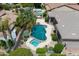 Aerial shot of the private backyard pool featuring a spa, mature landscaping and an outdoor barbecue at 2612 S Jacob St, Gilbert, AZ 85295