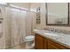 Bathroom featuring a single sink vanity with granite counters and a bathtub with shower at 2612 S Jacob St, Gilbert, AZ 85295