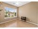 Bedroom featuring wood floors, neutral walls, and a ceiling fan at 2612 S Jacob St, Gilbert, AZ 85295
