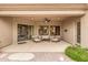 Inviting covered patio with comfortable seating, ceiling fan, and seamless integration with the backyard at 2612 S Jacob St, Gilbert, AZ 85295