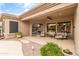 Relaxing covered patio with ample seating, perfect for outdoor entertaining and enjoying the serene backyard at 2612 S Jacob St, Gilbert, AZ 85295