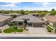Charming one-story home featuring a well-manicured lawn and a three car garage at 2612 S Jacob St, Gilbert, AZ 85295