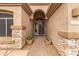 Inviting front entrance with decorative stone accents and arched entryway to a well-maintained home at 2612 S Jacob St, Gilbert, AZ 85295