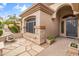 Charming front entrance with stone accents, desert landscaping, and a decorative fountain at 2612 S Jacob St, Gilbert, AZ 85295
