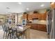 Spacious kitchen with granite countertops, stainless steel appliances, and a breakfast bar seating area at 2612 S Jacob St, Gilbert, AZ 85295