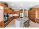 Wide view of kitchen featuring large island with seating and cabinetry with stainless appliances at 2612 S Jacob St, Gilbert, AZ 85295