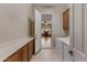 Well-organized laundry room with built-in cabinets, modern appliances, and easy access to other rooms at 2612 S Jacob St, Gilbert, AZ 85295