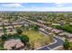 An aerial view of a quiet neighborhood featuring mature trees, well-kept lawns and desert landscaping at 2612 S Jacob St, Gilbert, AZ 85295