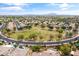 A residential neighborhood aerial featuring desert landscaping, mature trees, and mountain views at 2612 S Jacob St, Gilbert, AZ 85295