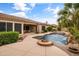 Resort-style pool area with a waterfall feature and a built-in fire pit at 2612 S Jacob St, Gilbert, AZ 85295