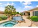 Stunning backyard oasis with a pool, spa, and outdoor kitchen ideal for entertaining and relaxation at 2612 S Jacob St, Gilbert, AZ 85295