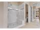 Bathroom featuring a glass shower with a seat and tiled flooring at 2612 S Jacob St, Gilbert, AZ 85295