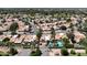 Community aerial view showcasing lush landscaping, tile roofs, and neighborhood amenities at 2663 N Carriage Ln, Chandler, AZ 85224