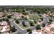 Aerial view of the community featuring pool, sport courts, and lush greenery at 2663 N Carriage Ln, Chandler, AZ 85224