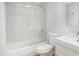 Bright bathroom featuring a shower-tub with tile surround and a sleek, modern vanity at 2663 N Carriage Ln, Chandler, AZ 85224