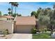 Charming single-story home with tile roof and well-maintained landscaping at 2663 N Carriage Ln, Chandler, AZ 85224