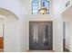 Home foyer featuring a decorative light fixture, and an ornate, double-door entryway at 2663 N Carriage Ln, Chandler, AZ 85224