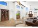 Spacious living room with vaulted ceilings, a fireplace, and ample natural light at 2663 N Carriage Ln, Chandler, AZ 85224