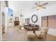 Bright living room features vaulted ceilings, a cozy fireplace, and natural light at 2663 N Carriage Ln, Chandler, AZ 85224