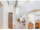 Open concept living space with high ceilings, a fireplace, and large windows at 2663 N Carriage Ln, Chandler, AZ 85224