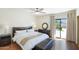 Spacious main bedroom boasts a ceiling fan, ensuite bathroom, and a sliding door to the backyard at 2663 N Carriage Ln, Chandler, AZ 85224