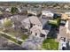 Stunning aerial view of a two-story home with lush landscaping and a three-car garage at 2988 E Comstock Dr, Gilbert, AZ 85296