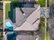 Aerial view of a house with a pool, patio and well-maintained landscaping at 2988 E Comstock Dr, Gilbert, AZ 85296