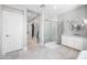 Elegant bathroom features a glass enclosed shower and a marble topped vanity at 2988 E Comstock Dr, Gilbert, AZ 85296