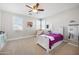 Light filled bedroom with neutral walls and carpet features a single bed and bright windows at 2988 E Comstock Dr, Gilbert, AZ 85296