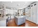 Bright kitchen with white cabinets, granite counters, stainless appliances, and gray island at 2988 E Comstock Dr, Gilbert, AZ 85296