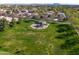 Aerial view of community park with playground and spacious grassy areas at 2988 E Comstock Dr, Gilbert, AZ 85296