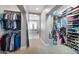 Spacious walk-in closet provides ample storage for clothing, shoes and accessories at 2988 E Comstock Dr, Gilbert, AZ 85296