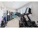 This home gym features a variety of exercise equipment including a treadmill and weights at 2988 E Comstock Dr, Gilbert, AZ 85296