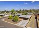 Charming home featuring a well-manicured lawn, mature trees, solar panels, and a convenient carport at 3002 E Montecito Ave, Phoenix, AZ 85016