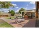 Outdoor living space featuring a covered patio, bar and orange tree at 3002 E Montecito Ave, Phoenix, AZ 85016