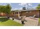 The backyard features a covered patio and citrus tree at 3002 E Montecito Ave, Phoenix, AZ 85016